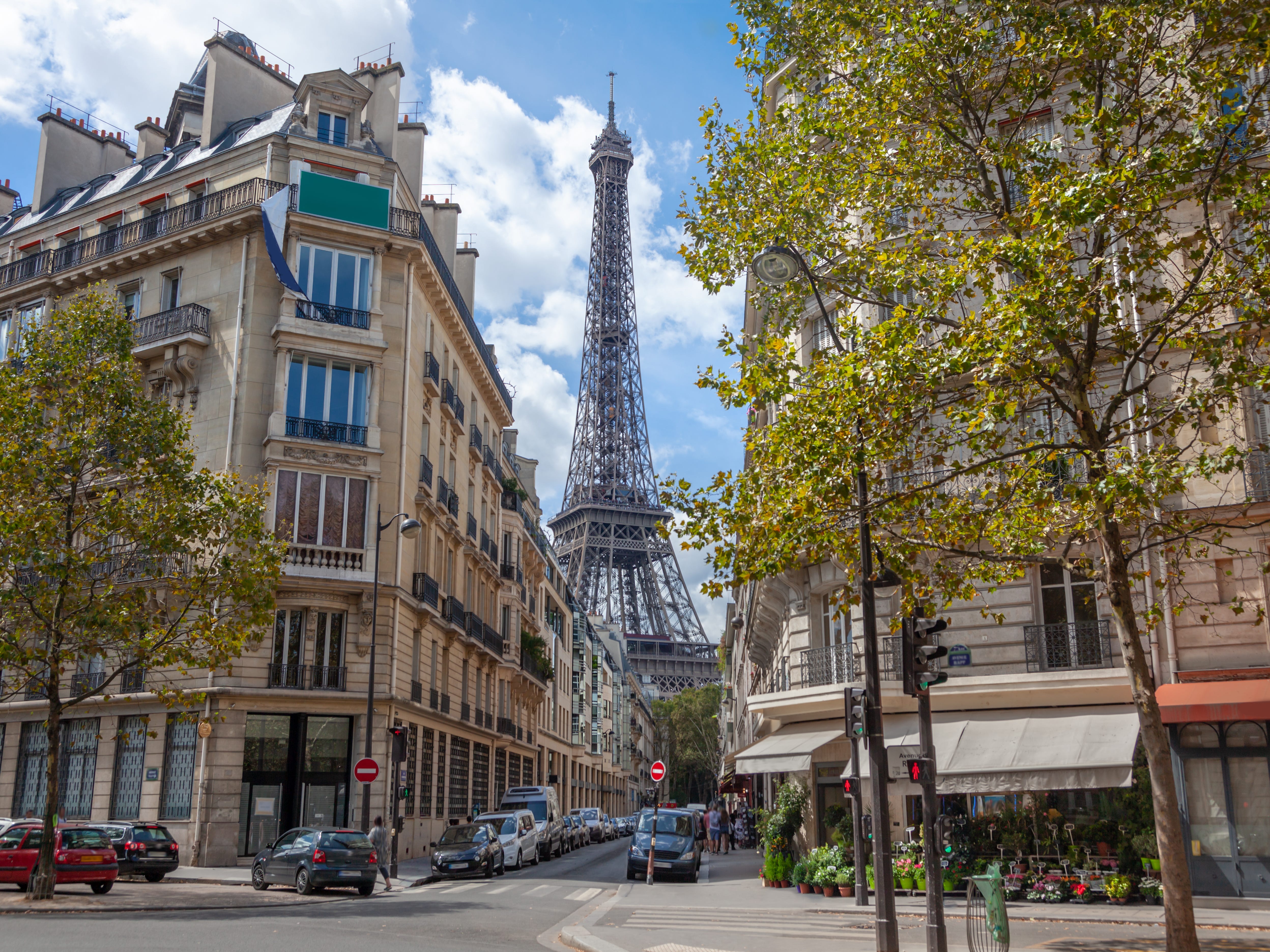 The view of the Eiffel Tower through buildings in Paris.