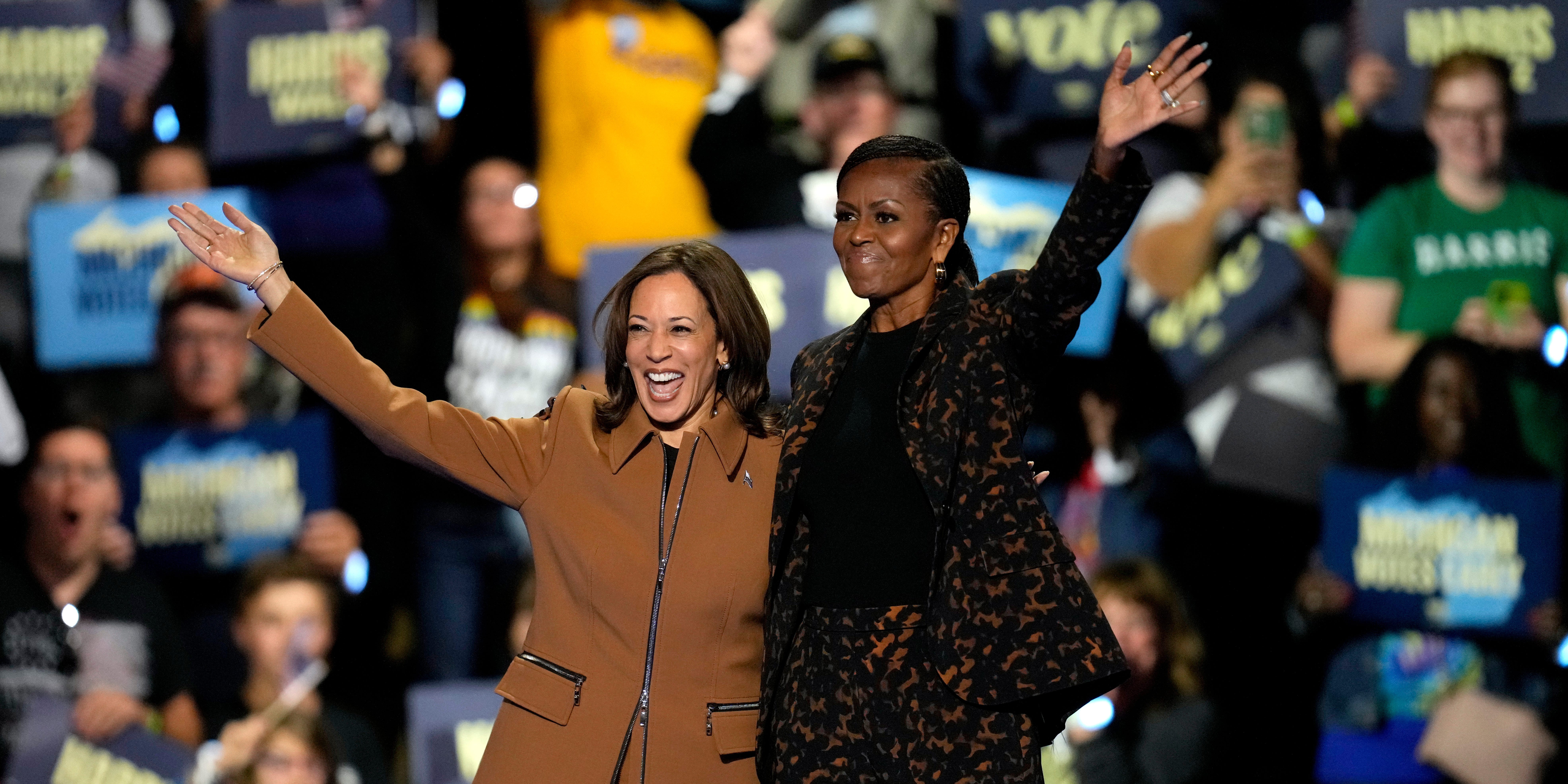 Vice President Kamala Harris stands close to former First Lady Michelle Obama.