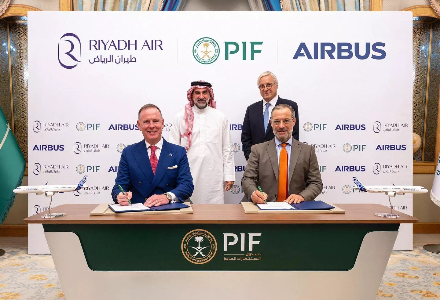 Representatives from Airbus and Riyadh Air, including Christian Scherer and Tony Douglas, sign a deal for Airbus jets in Riyadh.