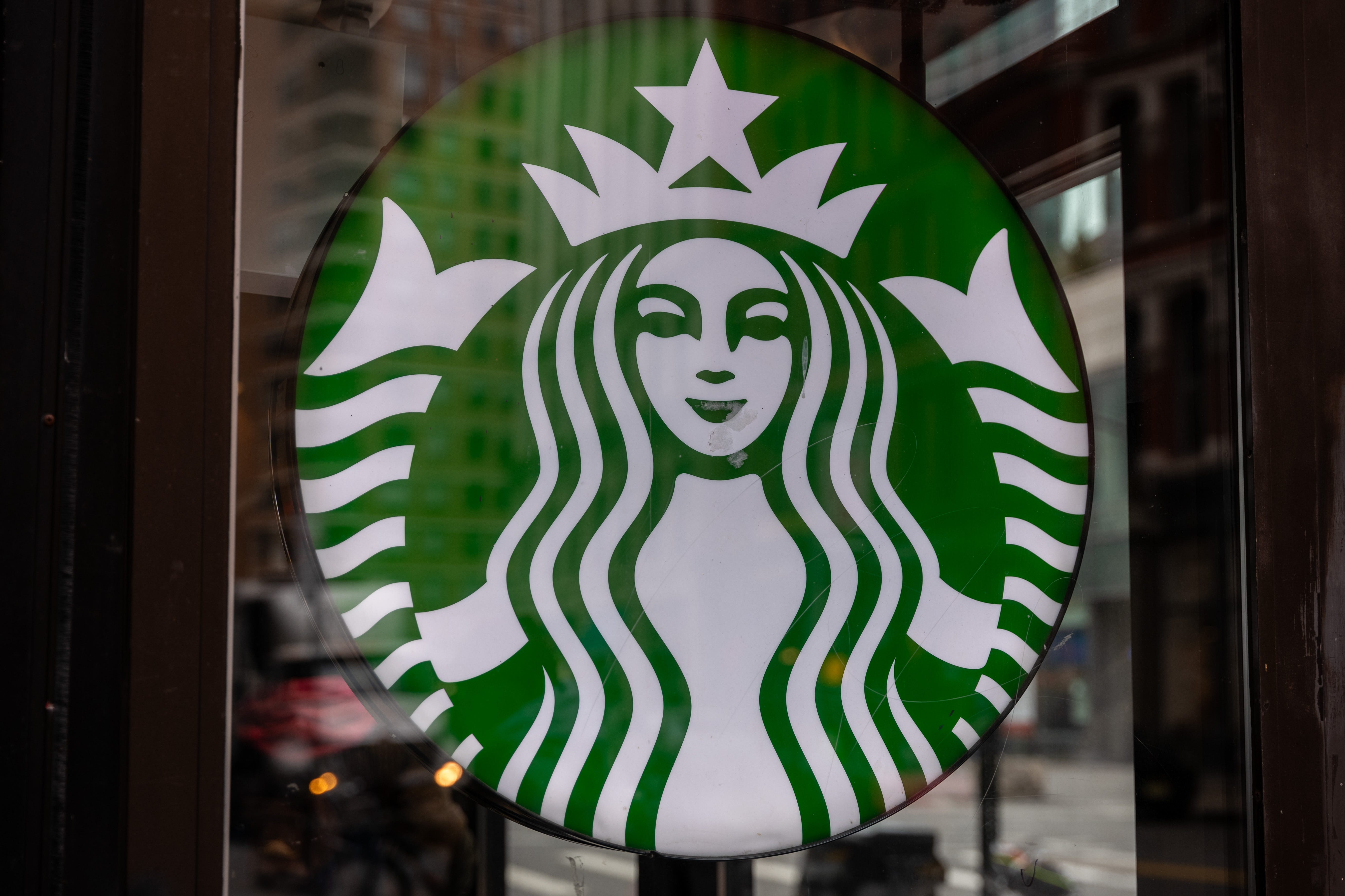 Starbucks logo on store window.