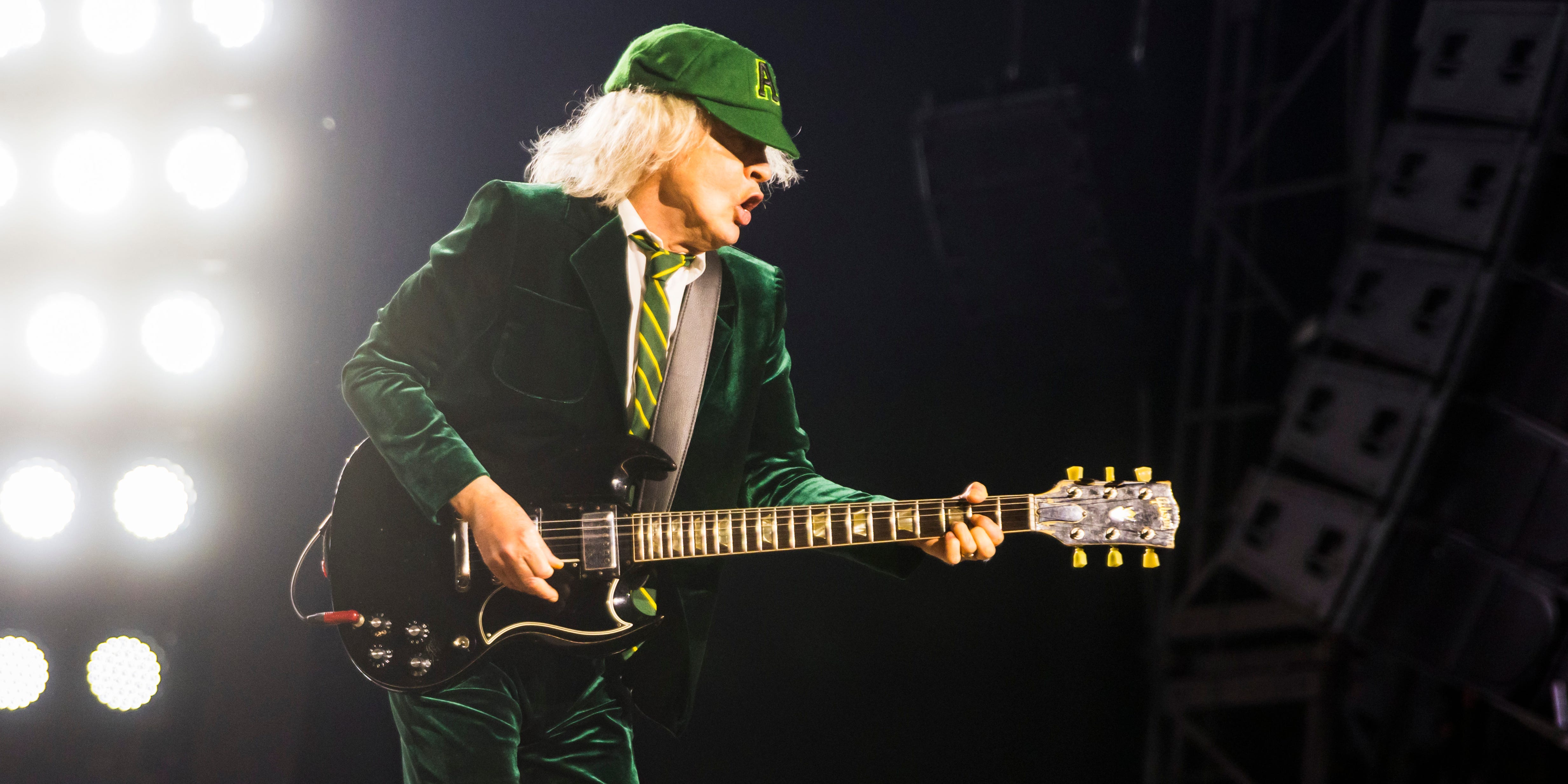 Guitarist Angus Young of the band AC/DC perform live on stage during a concert at Arena AufSchalke on May 17, 2024 in Gelsenkirchen, Germany