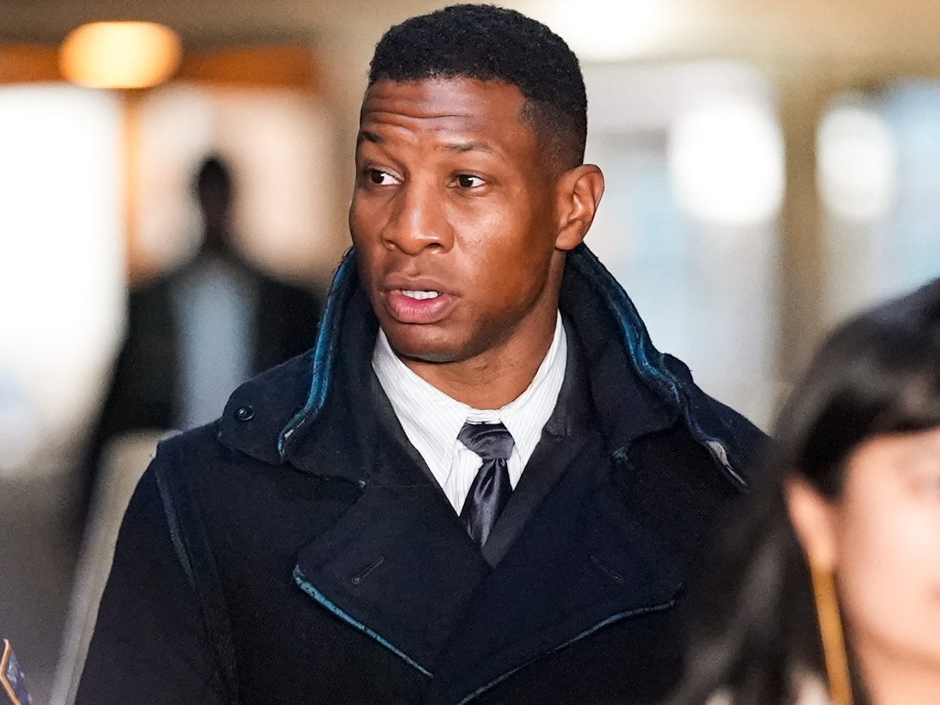 Actor Jonathan Majors leaves the courthouse following closing arguments in Majors' domestic violence trial at Manhattan Criminal Court on December 15, 2023 in New York City. Majors had plead not guilty but faces up to a year in jail if convicted on misdemeanor charges of<br /><a href=