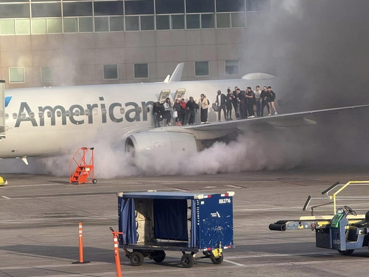 Passengers walking on American Airlines Flight 1006 plane on Thursday after landing at Denver airport on Thursday